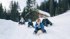 Tobogganing fun with the whole family at the toboggan run Oberlech
