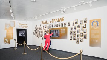 Visitors in front of the WALL of FAME in the HALL of FAME